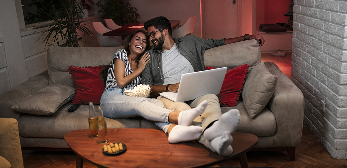Lounge couple enjoying tv | CB | 1200x580 Lounge couple enjoying tv | CB | 1200x580